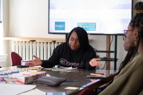 zaniya sitting at a desk